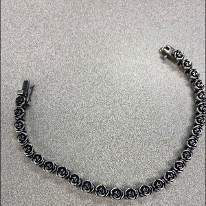 Sterling silver rose tennis bracelet.  6.75 inch